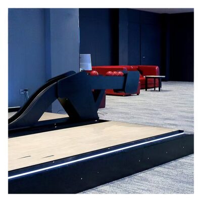 Bowling ball return for amusement bowling centers
