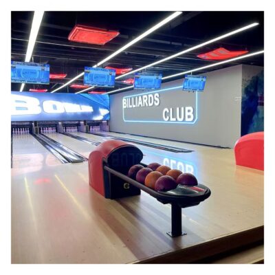 Bowling ball return for amusement bowling centers