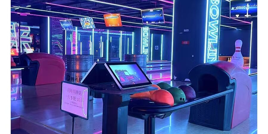 Bowling ball return for amusement bowling centers