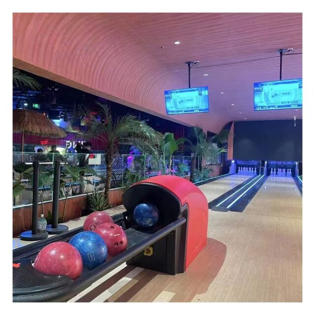 Bowling ball return for amusement bowling centers